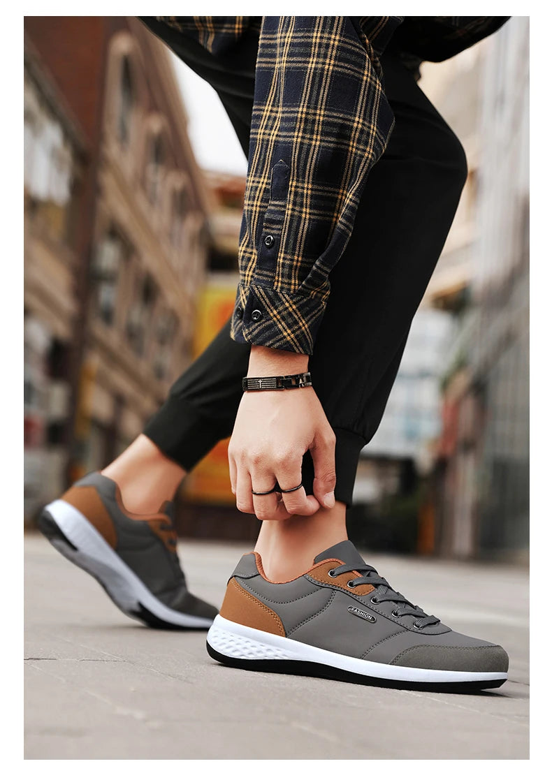 tenis masculino cinza detalhes marrom 1