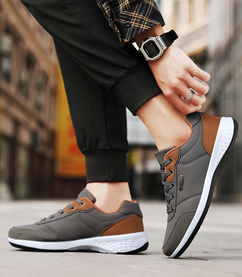 tenis masculino cinza detalhes marrom